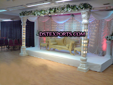 ASIAN WEDDING STAGE WITH FLOWERED PILLARS